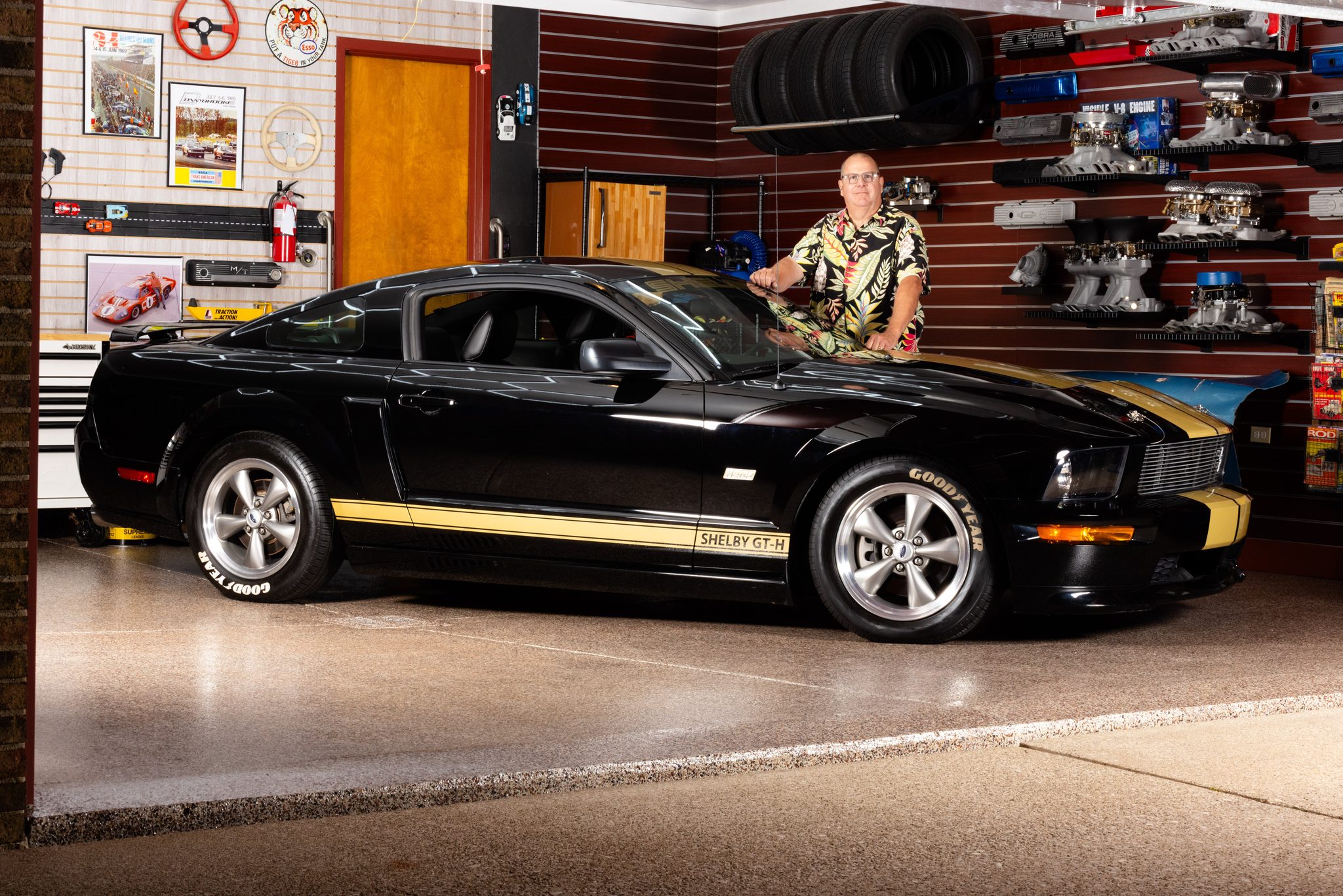 Passion portrait of a car collector with his black-and-gold Shelby GT-H in a vintage hot rod garage — A2 Portraits, Ann Arbor