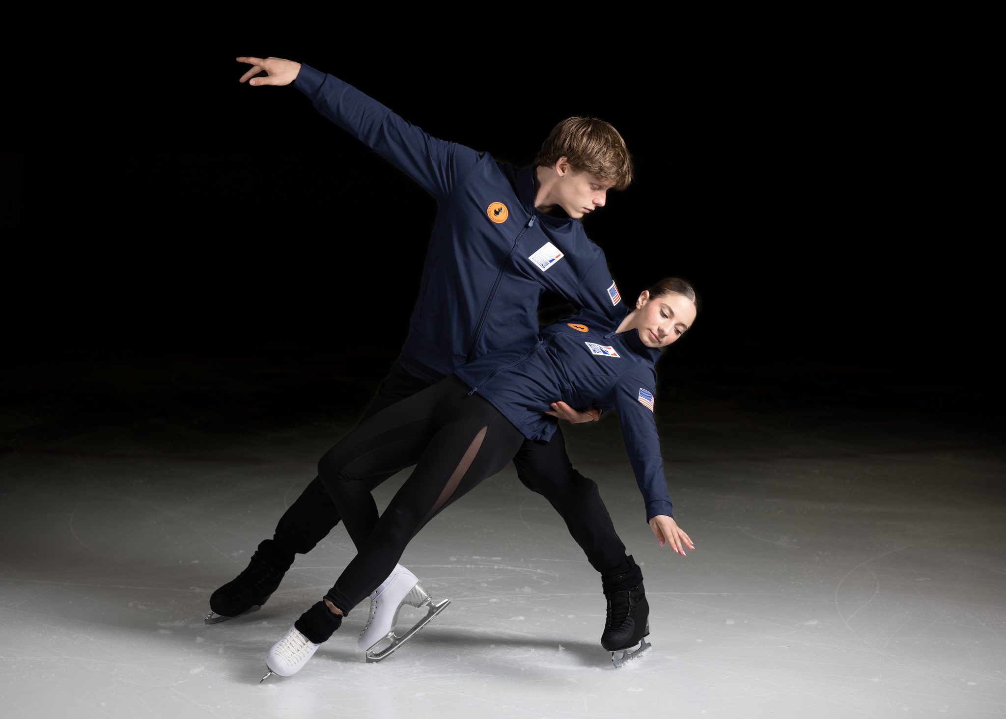 Figure skating pair in a dramatic ice dance lift pose on the rink — fine art athlete portrait, A2 Portraits Ann Arbor
