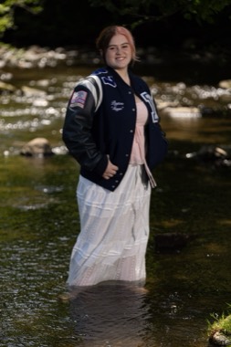 She asked if she could actually stand in the water. That's always the right answer. The jacket over the white skirt was her idea, and it's the entire portrait.